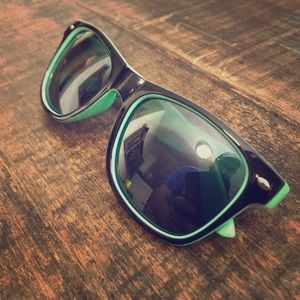 Sea foam green and black sunglasses.